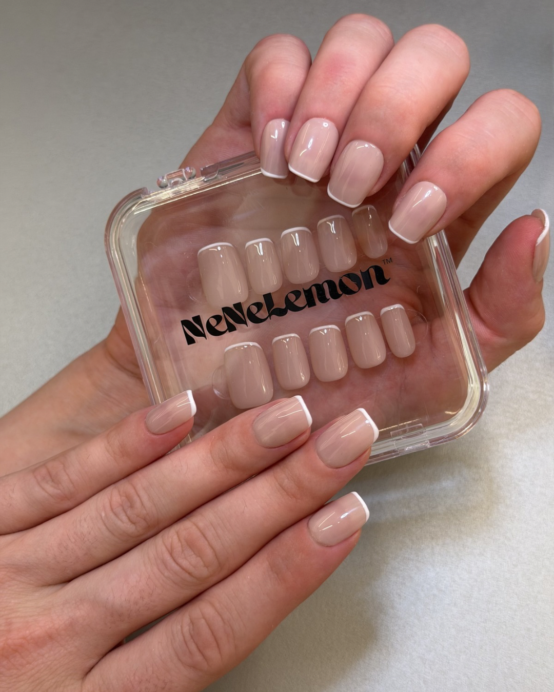 Pink nude french press ons short squoval worn on hands, everyday look  