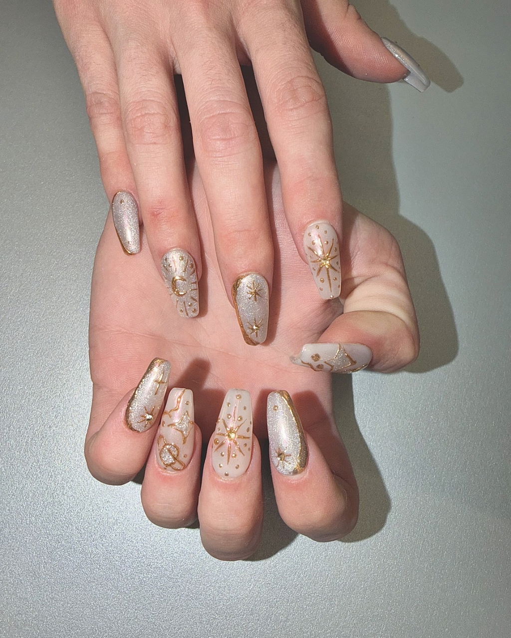 Pink silver chrome press ons long squoval worn on hands special look